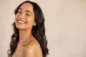 A woman smiling after IPL therapy in Jacksonville, FL